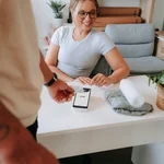 Customer paying by card at a payment terminal