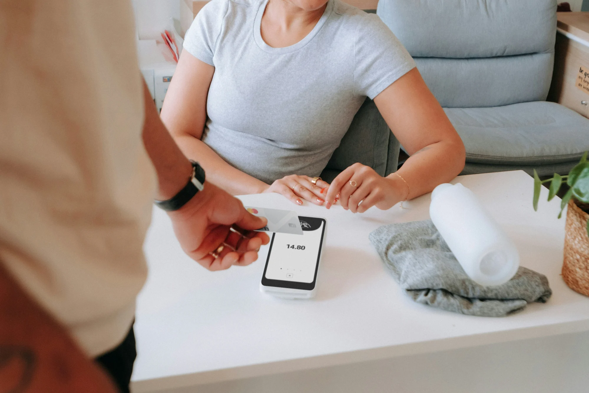 Customer paying by card at a payment terminal